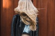 © Ira Efremova Photography/Stocksy - Young blond woman with long hair shaking her head side to side