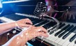 © BillionPhotos.com - Close up of a musician playing a piano keyboard