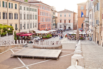 Wall Mural - Ancona, Italy - June 8 2019: People enjoying summer day and food at outdoor restaurant and resting.