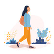 © AmadeaN - Happy Young Woman walking outside around the city with backpack. Vector character illustration in a flat style on a white background