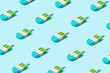 Trendy sunlight Summer pattern made with popsicle ice cream on bright light blue background. Minimal summer concept.