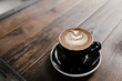 © Lauren Edmonds/Stocksy - Cappuccino on rustic wooden table