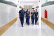 © Per Swantesson/Stocksy - Team of doctors walking in a corridor