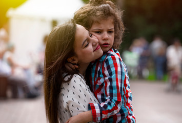 portrait of a cheerful girl and boy hugging fun in outdoor