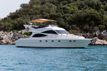A Luxurious Powerboat Cruising Through Beautiful Blue Waters.Side View
