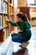 © Bonninstudio/Stocksy - Student on library.