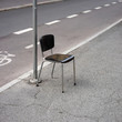 © Marcel/Stocksy - Chair on the street