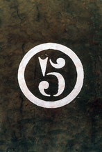 Number 5 Printed On White Over Grunge Wall