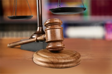 Sticker - Wooden gavel on wooden table, on  background