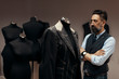 © Mika Knezevic/Stocksy - Portrait of a man fashion designer in atelier