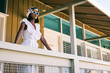 © visualspectrum/Stocksy - Young Fashionable Black Woman With Headscarf Posing in Stylish M