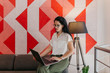 © Boris Jovanovic/Stocksy - Young business woman working in a co-working environment