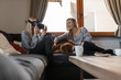 © Milles Studio/Stocksy - Laughing women with VR goggles at home