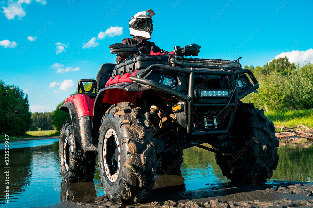 ATV in nature. Outdoor activity. Quad bike rides. Extreme sport. Forest ...