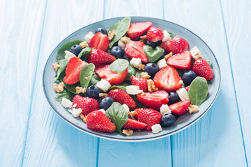 Wall Mural - Summer Strawberry salad with spinach , cheese , nuts and blueberry