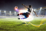 Fototapeta Sport - Soccer player on stadium in action. Mixed media