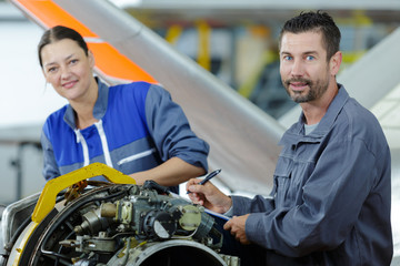 factory workers working with engine