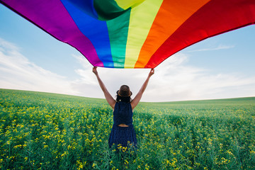 Gay Rainbow Flag on a green meadow outdoors