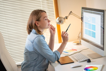 Fototapete - graphic designer sitting at work. Illustrator. web designer. freelancer