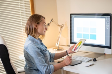 Fototapete - graphic designer sitting at work. Illustrator. web designer. freelancer