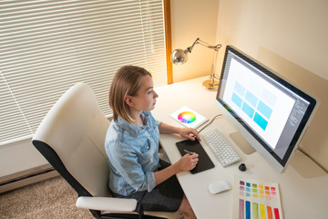 Fototapete - graphic designer sitting at work. Illustrator. web designer. freelancer