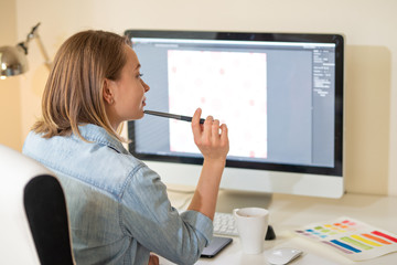Fototapete - graphic designer sitting at work. Illustrator. web designer. freelancer