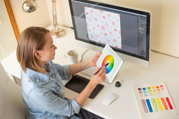Fototapete - Girl graphic web designer. working on a project. work with color. freelance designer