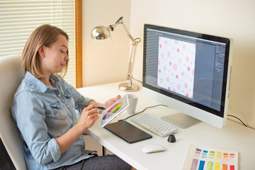 Fototapete - Girl graphic web designer. working on a project. work with color. freelance designer