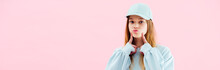 Panoramic Shot Of Pretty Teenage Girl In Cap Grimacing Isolated On Pink