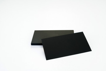 Wall Mural - Photo of black blank business cards on a white background. Templ