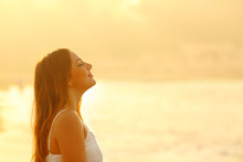 Woman At Sunset Relaxing Breathing Fresh Air