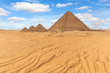 The Pyramid of Menkaure and the small pyramids in the beautiful desert of Giza, Egypt