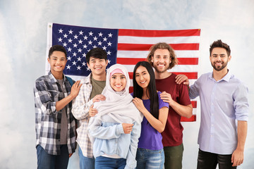 Wall Mural - Group of students near wall with USA flag