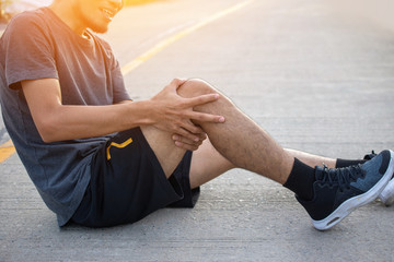 Wall Mural - Man Runner Jogging for Exercise on Morning  but Accident Knee pain while running,Sport And Healthy