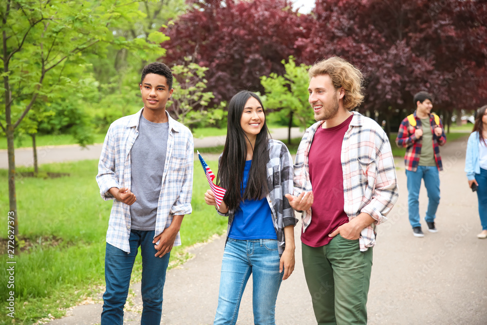 Group of students with USA flag outdoors