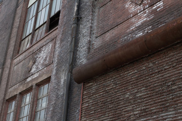 Wall Mural - Architectural details of old industrial building, brick work with rusting roll up door, horizontal aspect