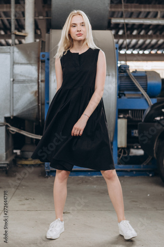 black dress and white sneakers