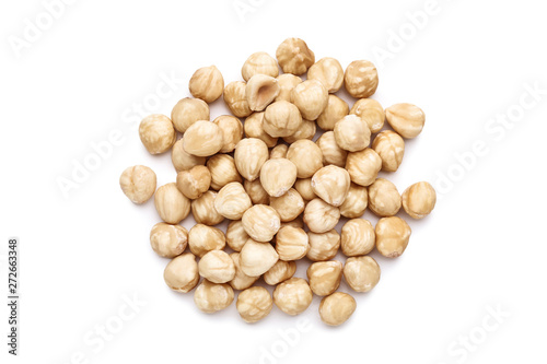 Cuadros en Lienzo Peeled hazelnuts on isolated white background