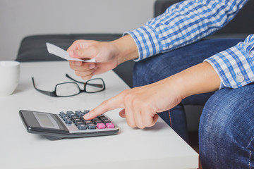 Poster - A man wearing striped shirts Scottish blue. Calculate bills with Calculator.