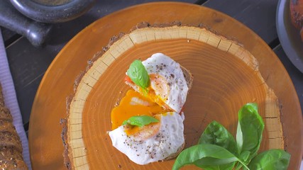 Sticker - Sliced sandwich with egg. The yolk is flowing