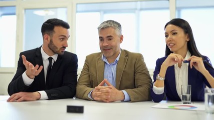 Poster - The three business people working with a virtual display