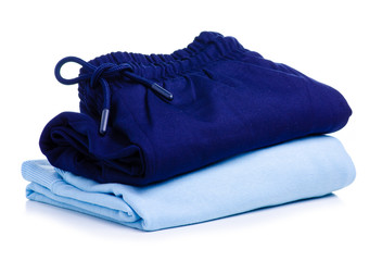 Stack blue folded clothing on white background isolation