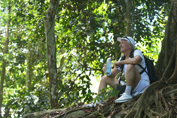 Poster - Portrait of elderly man in tropical forest