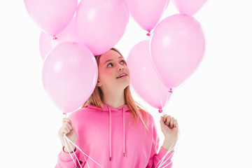 Wall Mural - happy teenage girl looking at pink balloons isolated on white