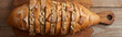 top view of slices of white and brown bread with seeds in loaf on wooden chopping board, panoramic shot