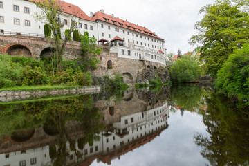 View of the Vltava River and the Church with the Reflection of the Cesky Krumlov River with the Famous Cesky Krumlov Castle, the UNESCO World Heritage Site