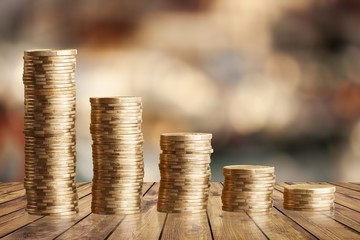 Wall Mural - Golden coin stacks on a white background