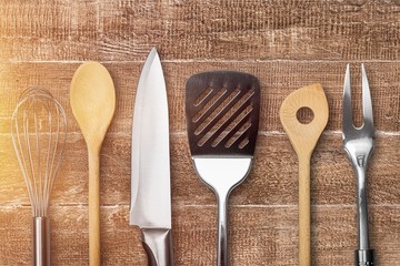 Wall Mural - Kitchen metal and wooden utensil on  background