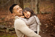 © Cavan for Adobe - Smiling father carrying his daughter in forest
