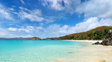 Wall Mural - Tropical beach on sunny day with mountains in distance